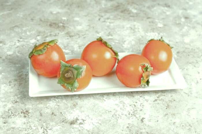 عوارض خوردن خرمالو