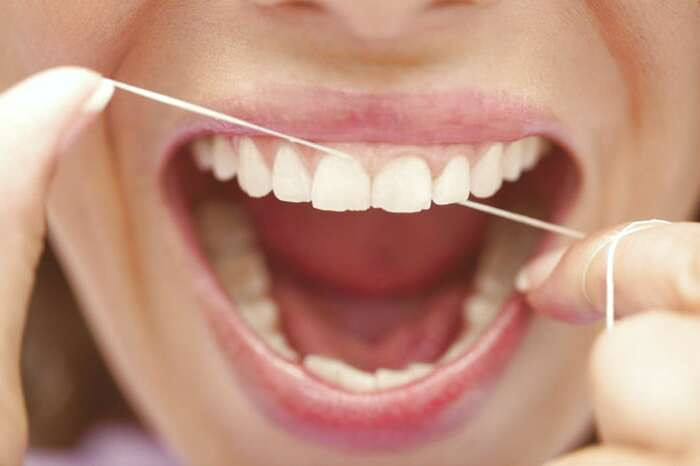 اهمیت استفاده از نخ دندان