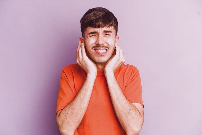 علت گرفتگی گوش